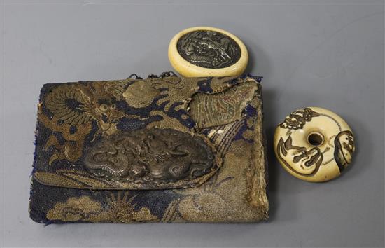 A Japanese Meiji leather tabako-ire or purse with ivory manju netsuke and another ivory manju netsuke